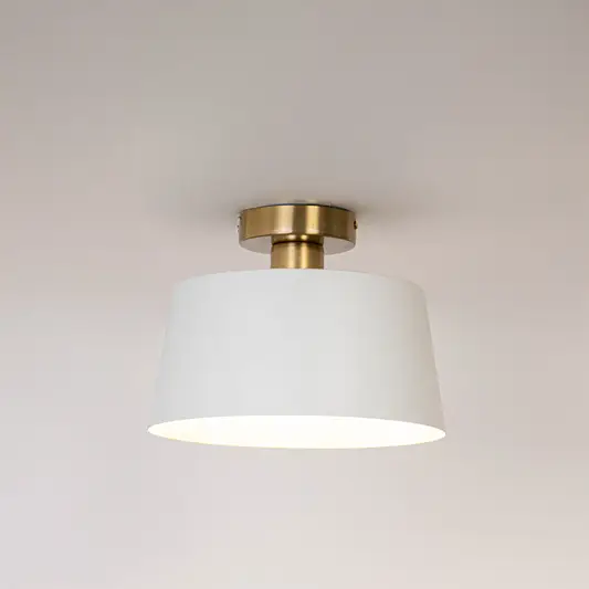 Modern white metal ceiling light with soft illumination for elegant hallway and minimalist home decor spaces.