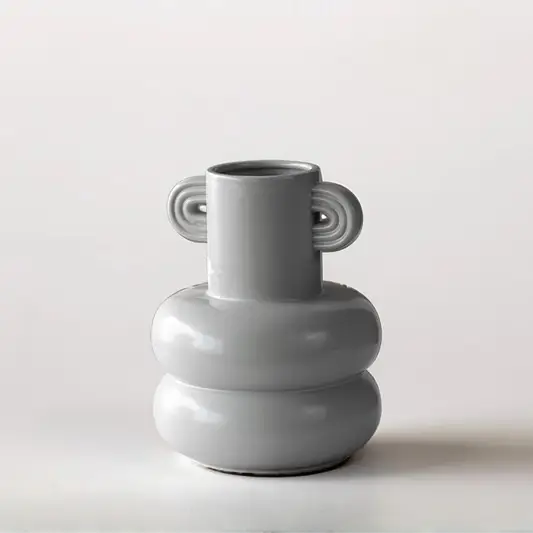 White ceramic sculptural vase with rounded stacked design for tabletop styling and modern home decor displays.