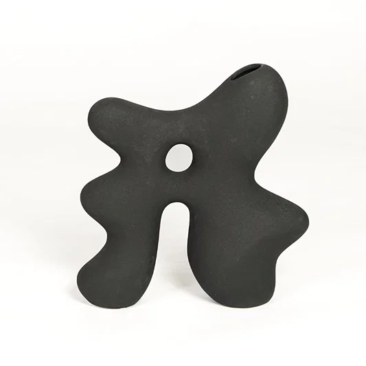Modern dark grey ceramic statement decor vase with unique hollow center for minimalist interiors.