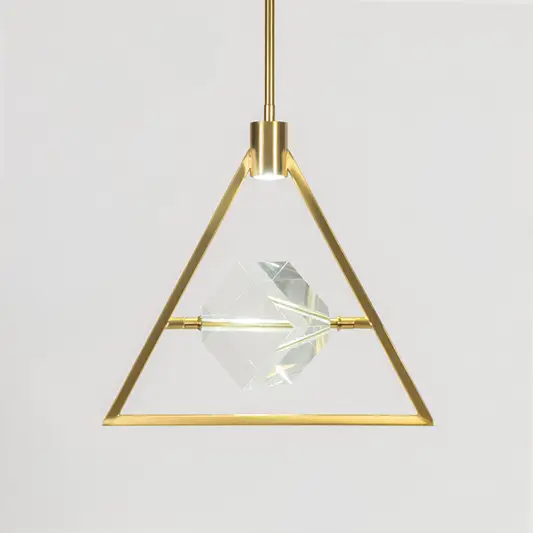 Artistic pendant light in gold metal finish with geometric frame and glass element for dining or living decor lighting white background.