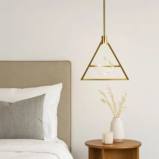 Gold metal geometric pendant light adding warm ambience to contemporary bedroom interior spaces.