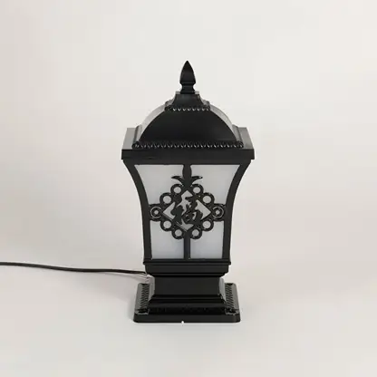 Black outdoor post light seeded glass Light Off Black Background style image showing the durable metal fixture next to a tree.