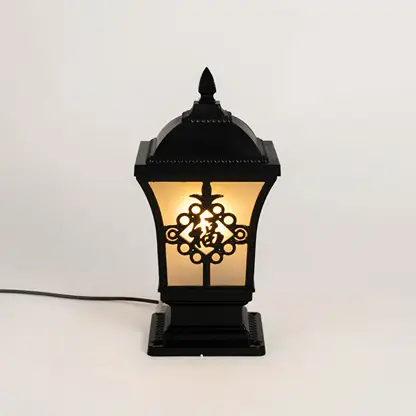 Decorative black outdoor gate light with floral glass panels for luxury exterior decor styling.