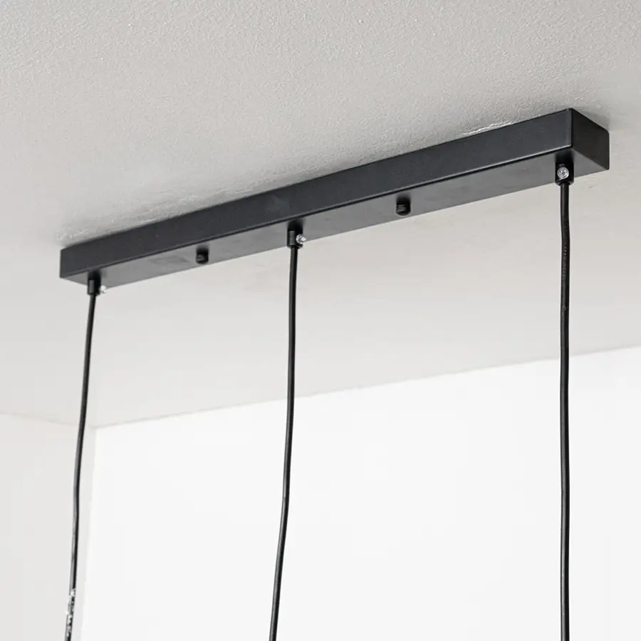 Black metal linear ceiling canopy with hanging cords highlighting premium finish and craftsmanship.