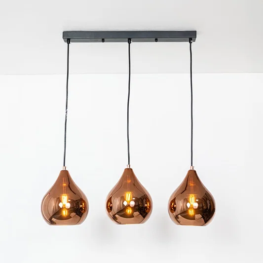 Amber glass pendant lights with metallic finish designed for stylish contemporary home decor spaces.