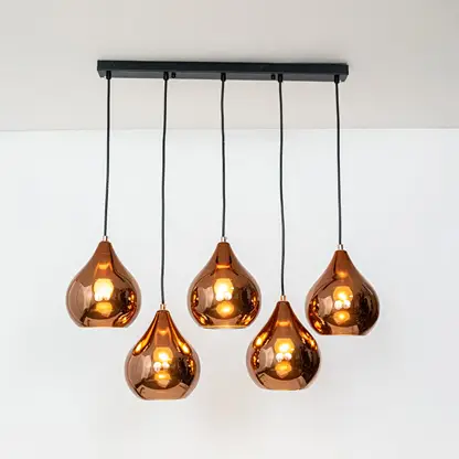 Amber metallic glass pendant lights with gold accents showcasing stylish contemporary home decor.