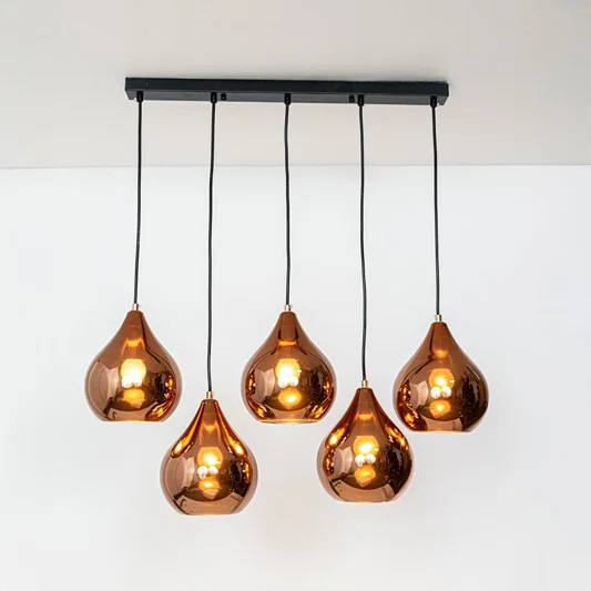 Amber metallic glass pendant lights with gold accents showcasing stylish contemporary home decor.