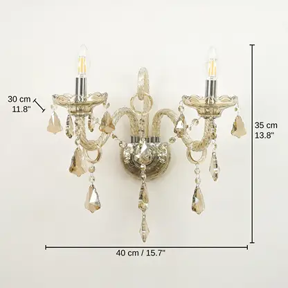 Two-light wall sconce with clear glass arms and hanging teardrop crystals, 35 x 40 x 30 cm (13.8 x 15.7 x 11.8 inches) dimensions