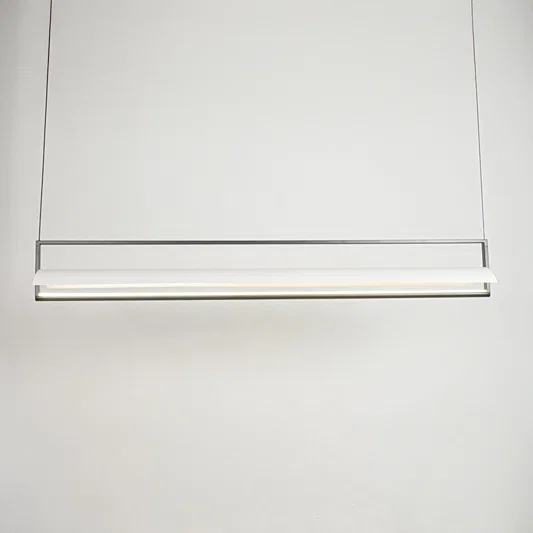 Minimal linear hanging light with sleek metal finish on clean neutral background ideal for modern kitchen or dining lighting.