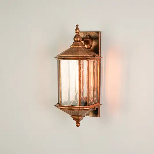 White background image of elora outdoor metal wall light for elegant patio decor styling with bright warm illumination.