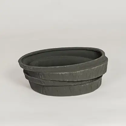 Modern black ceramic decorative bowl with textured stone design ideal for fruit display dining table centerpiece and kitchen decor styling.