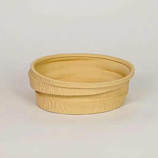 Beige ceramic decorative bowl with layered textured design for modern tabletop shelf and console decor placement.