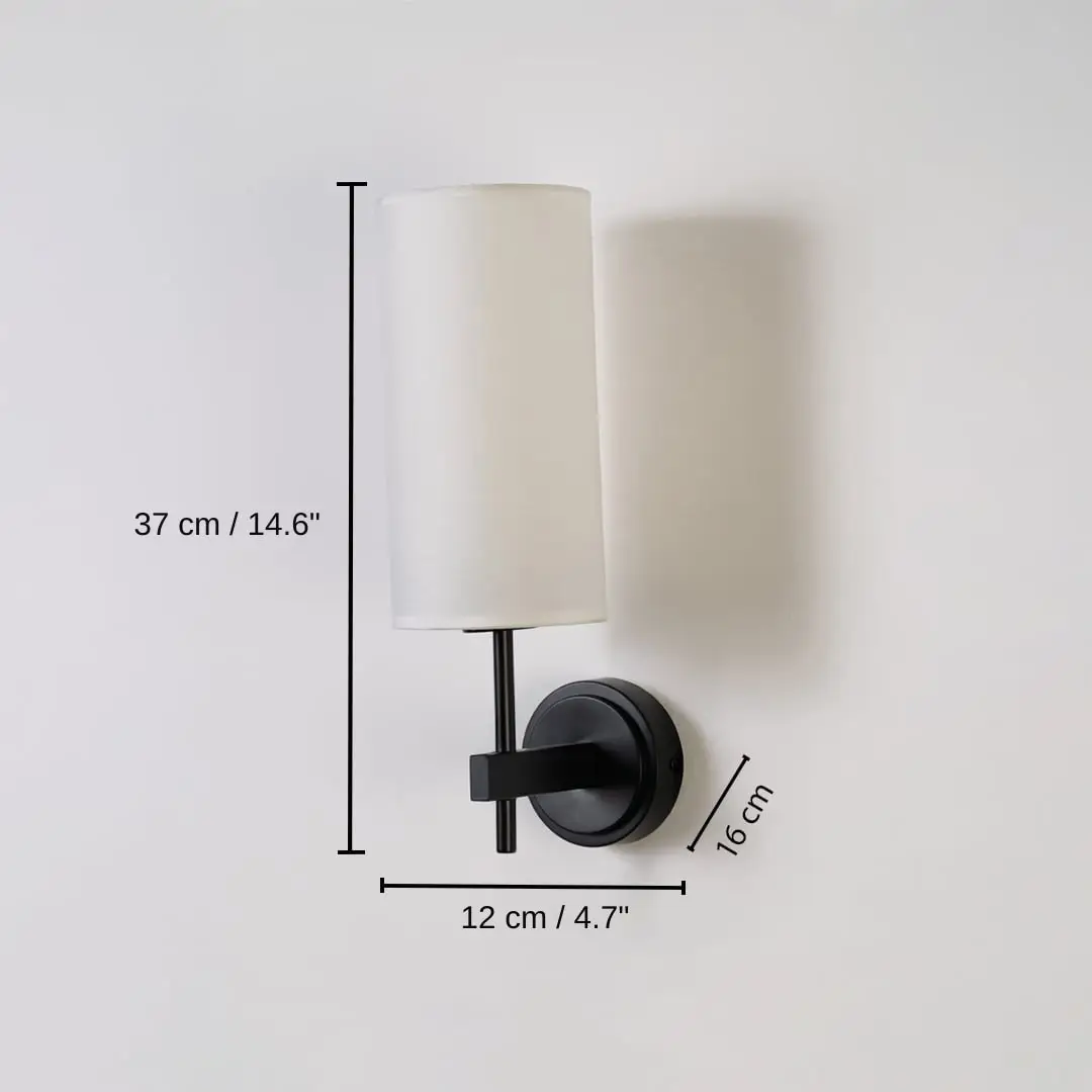 Black metal wall light with tall white fabric shade, base 37 x 12 x 16 cm (14.6 x 4.7 x 6.3 inches), canopy 10 x 10 cm (3.9 x 3.9 inches) dimensions