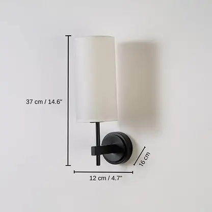 Black metal wall light with tall white fabric shade, base 37 x 12 x 16 cm (14.6 x 4.7 x 6.3 inches), canopy 10 x 10 cm (3.9 x 3.9 inches) dimensions