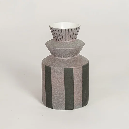 Erebus ceramic vase with striped textured body and sculpted neck isolated on clean white background for modern decor styling.