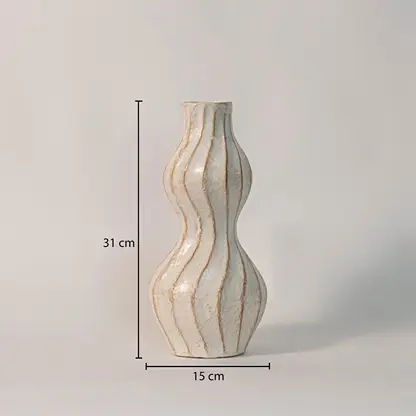Wavy ceramic vase measuring 31 cm in height and 15 cm in width - ideal as a statement decor piece or flower vase.