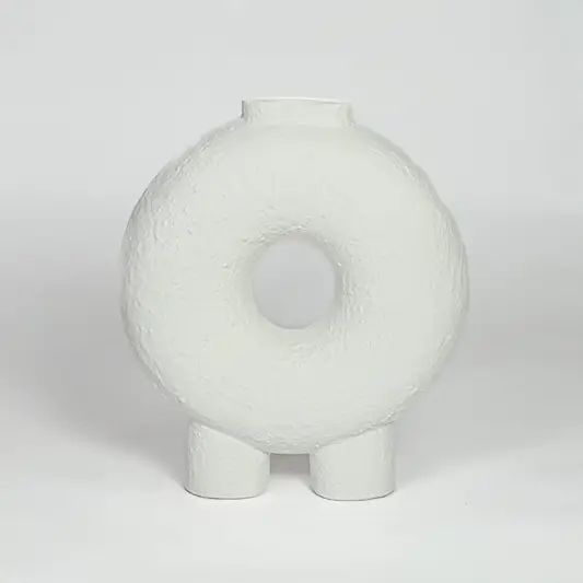 White ceramic donut vase with textured finish and round hollow center isolated on clean white background for modern decor styling.