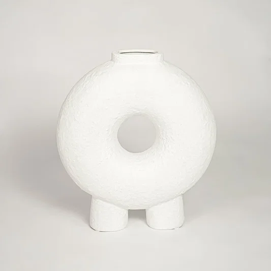 Contemporary white ceramic decorative vase with circular cutout perfect for entryway table living room or dining decor display.
