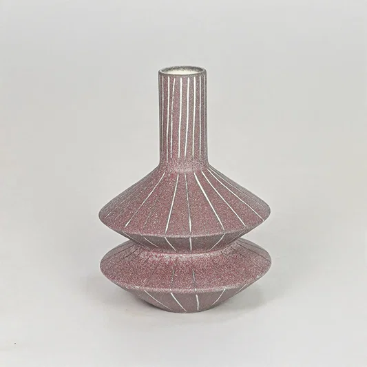 Matte terracotta tiered geometric vase with fine lines for modern home decor and artistic tabletop centerpiece.