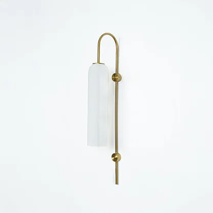 Modern gold metal wall light with white frosted glass shade for elegant bedroom and luxury decor spaces.