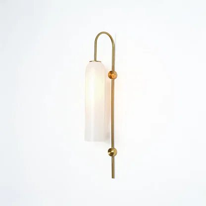 Modern gold metal wall light with white frosted glass shade for stylish bedroom and luxury decor spaces.

