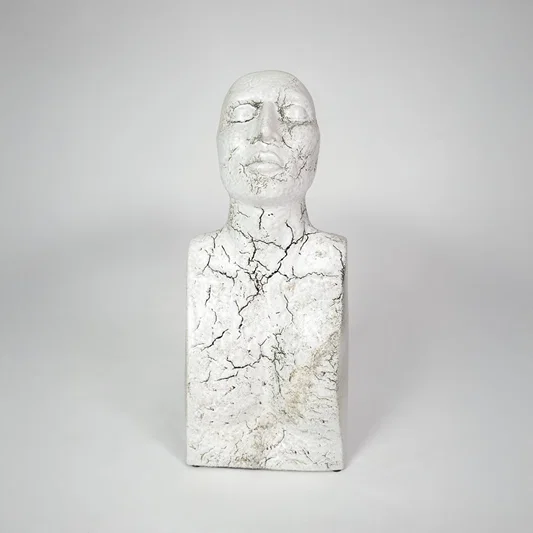 White marble texture face sculpture for modern shelf placement and artistic indoor home decor styling accent piece.