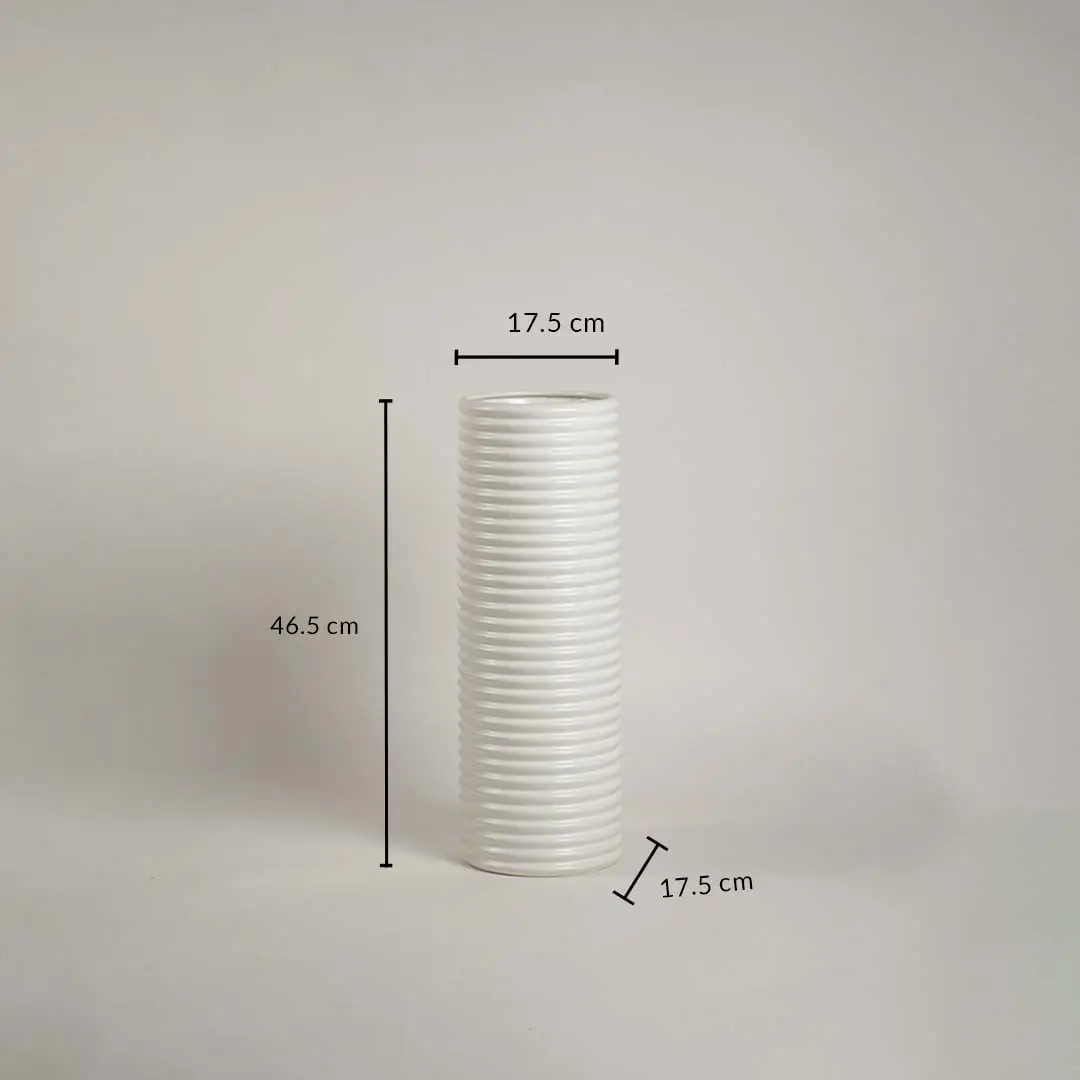 White ribbed ceramic vase measuring 46.5 cm height and 17.5 cm width shown on white background with handcrafted finish.