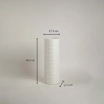White ribbed ceramic vase measuring 46.5 cm height and 17.5 cm width shown on white background with handcrafted finish.