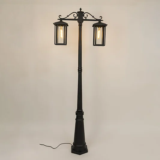 Vintage outdoor street lamp with dual lantern shades for elegant exterior decor styling use.