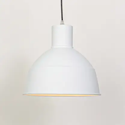 White metal dome pendant light with gold trim designed for modern dining room and home decor.