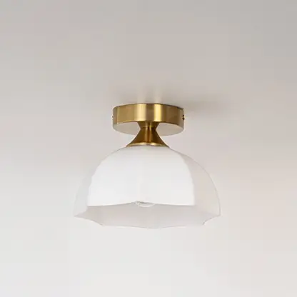 Modern white glass and gold metal ceiling light for stylish bedroom and premium interior decor styling spaces.
