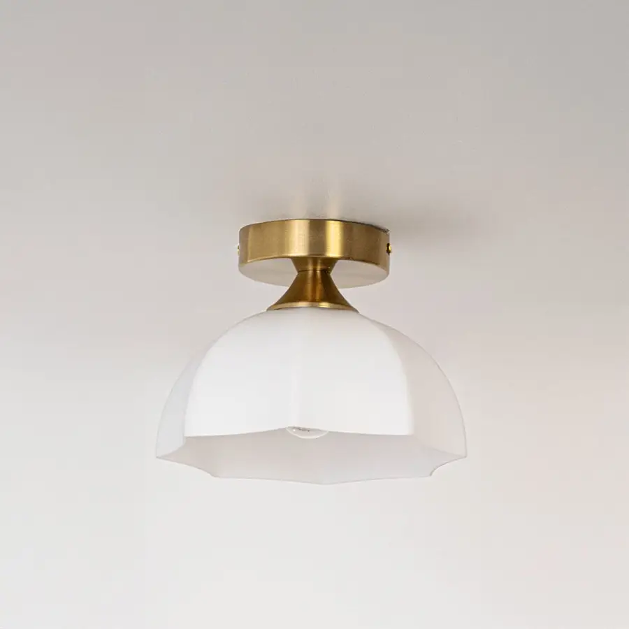 Modern white glass and gold metal ceiling light for stylish bedroom and premium interior decor styling spaces.