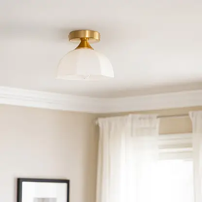 Modern white glass and gold metal ceiling light in elegant bedroom setting for classic home decor and ambient lighting spaces.