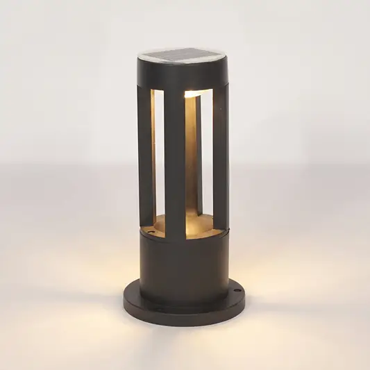 A modern outdoor bollard light with a matte black finish, featuring a solar panel on top and warm white LED lighting inside a cylindrical frame, set against a clean white background.