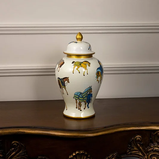 White ceramic jar with golden lid and colorful horse artwork perfect for elegant traditional home decoration styling.