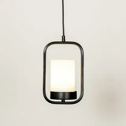 Black metal and white glass pendant light with modern lantern design for elegant home decor spaces.