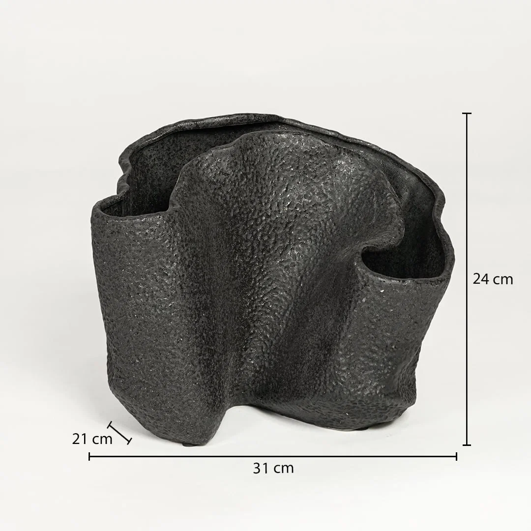 Black textured metal decorative vase measuring 24 cm height 31 cm width and 21 cm depth ideal for modern interior decor styling.