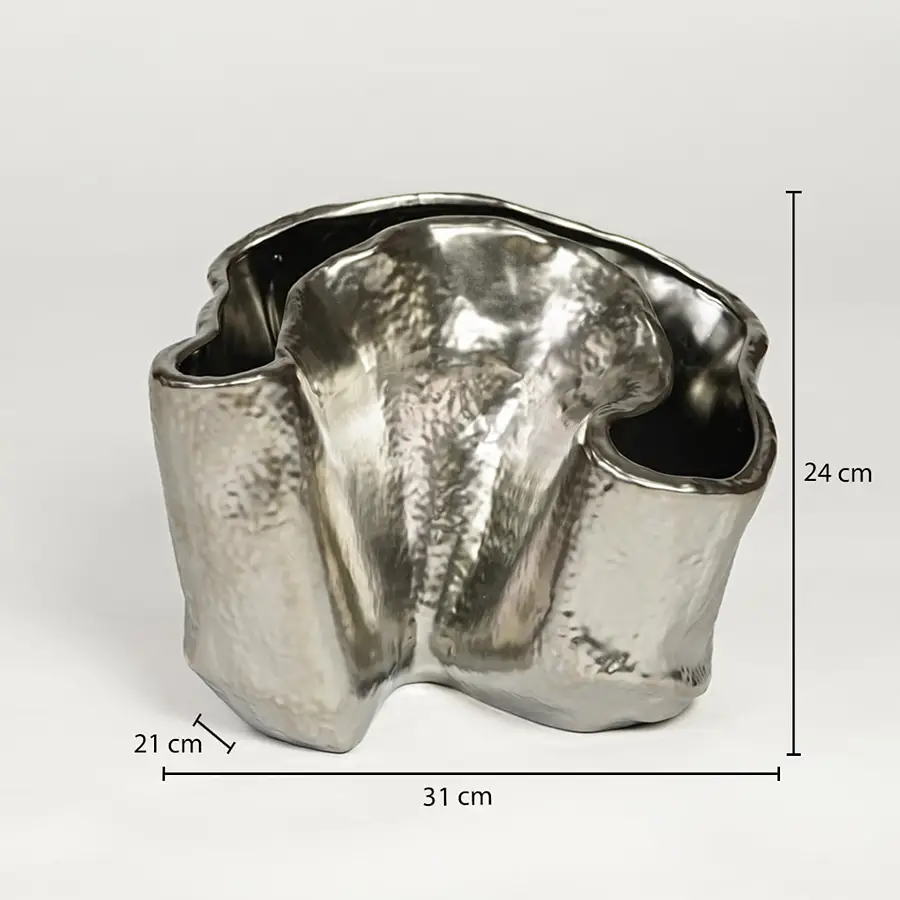 Silver metal decorative vase measuring 24 cm height 31 cm width and 21 cm depth ideal for modern table decor styling.