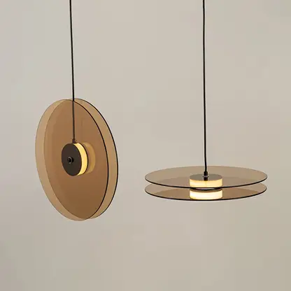 Brown wood and brass metal disc pendant lights showcasing elegant modern designs for interior spaces.