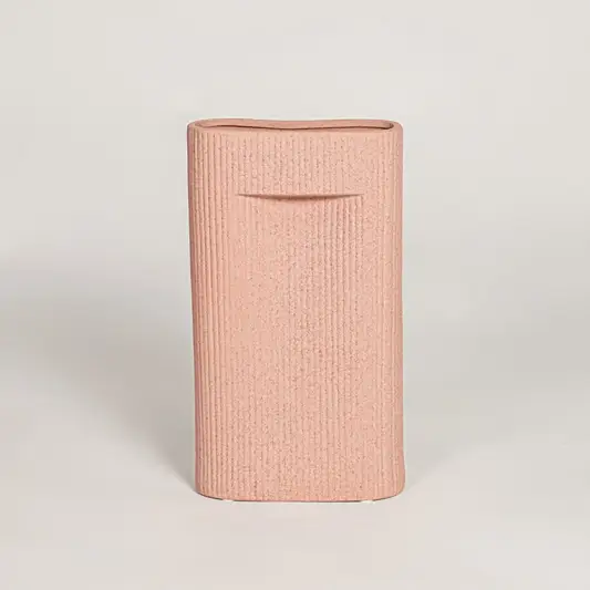 Contemporary peach ceramic flower vase with minimalist sculpted design perfect for entryway table living room decor display.