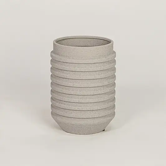 Textured grey ribbed cylindrical vase for minimalist home decor and contemporary interior table styling accents.