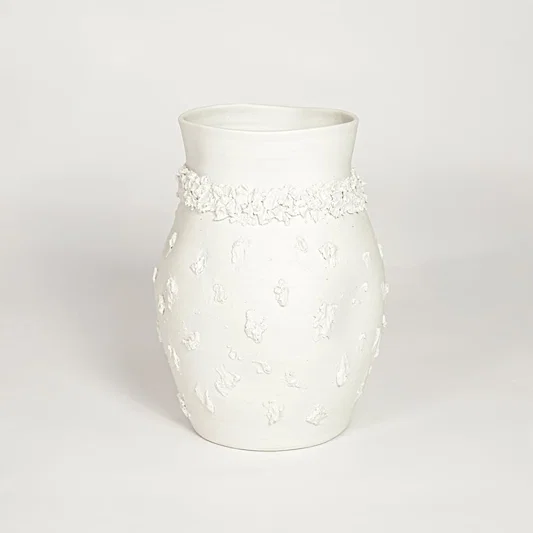 Classic white ceramic flower vase with ornamental texture perfect for entryway table living room or dining decor display.