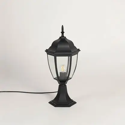Classic black outdoor pillar lamp with clear glass panels ideal for modern garden patio balcony and driveway lighting.
