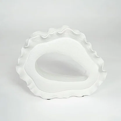 White ceramic decorative bowl with artistic irregular shape for minimalist tabletop styling and contemporary home decor.