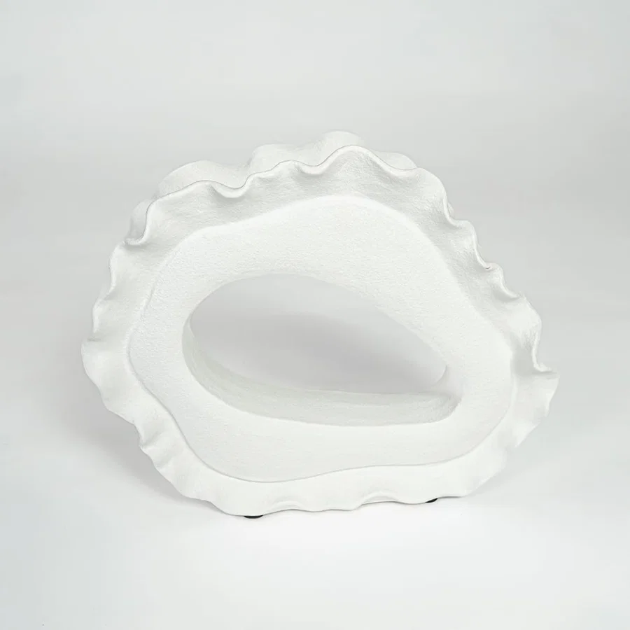 White ceramic decorative bowl with artistic irregular shape for minimalist tabletop styling and contemporary home decor.