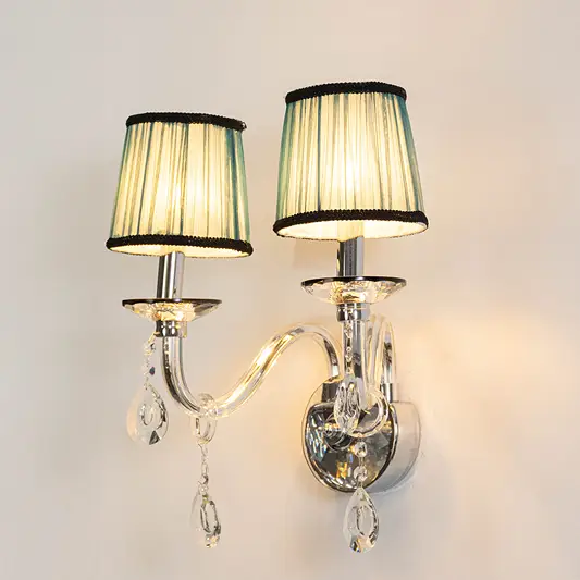 Gold metal wall light with black fabric shades and crystal accents for elegant luxury bedroom wall decor.