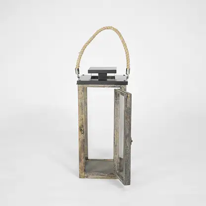 Wooden lantern with a rope handle on a white background
