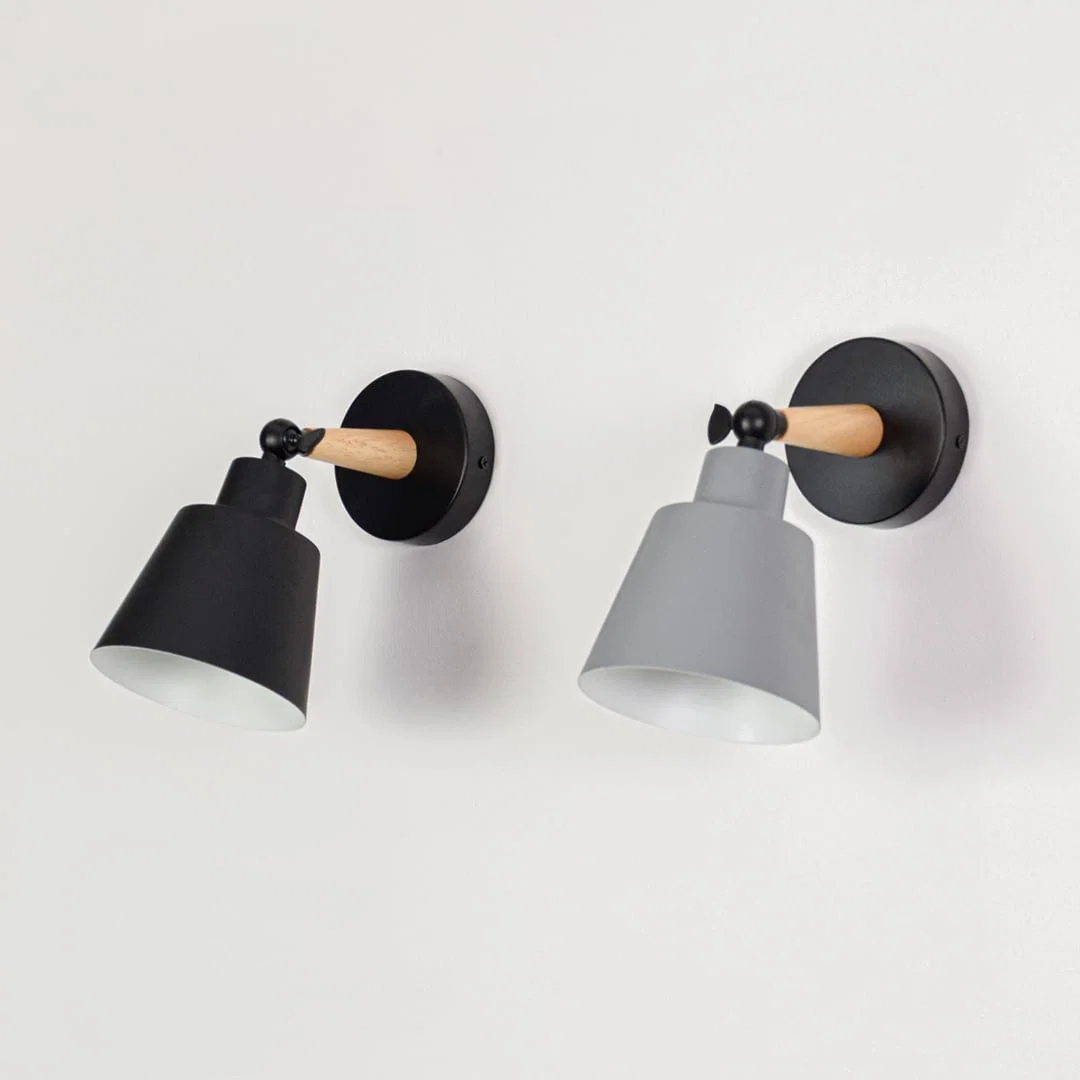 Pair of wall lights displayed together glowing showing color variation and consistent design ideal for coordinated lighting across modern interior spaces.