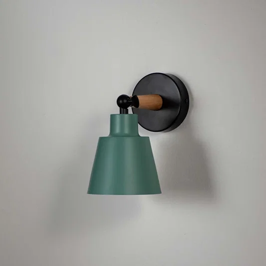 Modern wooden wall sconce with green conical lampshade light off white background for bedroom hallway and study stylish wall lighting decor.