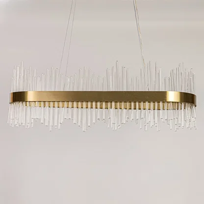 Gold metal chandelier with vertical glass rods displayed with lights off on a white background showing its sleek contemporary structure.